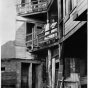 Black-and-white photograph of a three-story outhouse on State Street, c.1940.