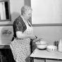 Black and white photograph of a woman using an electric mixer, 1938. Photographed by the Minneapolis Star Journal.