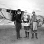 Black and white photograph of Santa Claus arriving via Northwest Airlines for a stay at L.S. Donaldson Company during the Christmas season, 1930.