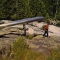 Color image of a group portaging a canoe in the Boundary Waters, ca. 1980. 