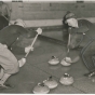 A curling game, 1937. Curling was introduced to Minnesota in the 1850s. Shown is action ca. 1935.