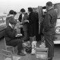 Black and white photograph of Tailgaters, Metropolitan Stadium, Bloomington, Minnesota. Photographer: Gillis, Minneapolis Star Tribune, 1964.