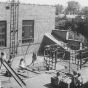 Black and white photograph of children playing on the playground of St. Paul’s Neighborhood House in 1937.