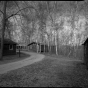 Northwest section of CCC Camp Rabideau F-50, looking southwest, with (left to right) barracks, education building, barracks, and recreation hall. Photo by Jerry Mathiason, 1994. From box 1 (144.G.8.4F) of Historic American Buildings Survey records related to Minnesota structures, 1882-2001, 1883. Manuscripts Collection, Minnesota Historical Society, St. Paul.