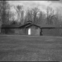 Exterior view of the mess hall (Building 8), CCC Camp Rabideau F-50. Photo by Jerry Mathiason, 1994. From box 1 (144.G.8.4F) of Historic American Buildings Survey records related to Minnesota structures, 1882-2001, 1883. Manuscripts Collection, Minnesota Historical Society, St. Paul.