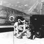 Black and white photograph of an air mail being loaded onto a Northwest Airlines plane, c.1940.