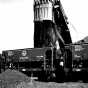 Black and white photograph of ore cars being loaded at the Hull-Rust mine at Hibbing, 1937.