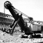 Black and white photograph of an electric shovel in operation at the Mesabi Mountain open pit mine in Franklin, ca. 1935. Photographed by Kurt B. Florman.