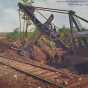 Color postcard depicting machinery at work stripping overburden for ore on the Mesabi Iron Range c.1905.