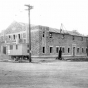 Black and white photograph of the exterior of Deerwood Auditorium exterior under construction, c.1936.