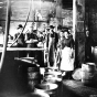 Black and white photograph of M. A. Gedney Compnay workers and vinegar barrels, c.1912.