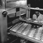 Pearson Candy Company employee checking chocolates on conveyor belt, St. Paul, ca. 1970.