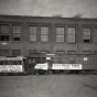 Black and white photograph of a 1872 horsecar compared to a new electric motor streetcar, May 3, 1921. Photographed by C.J. Hibbard.