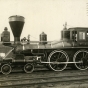 Black and white photograph of James J. Hill with two engineers on the William Crooks train engine, 1908. Photograph by T.W. Ingersoll. 