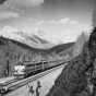 Black and white photograph of the Great Northern streamliner train in Glacier National Park, ca. 1955. Photograph by the Great Northern Railway.