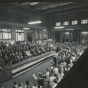 Black and white photograph of speaker’s stand and crowd at the 100th anniversary celebration of the Great Northern Railway at St. Paul’s Union Depot, 1962. 