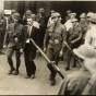 Black and white photograph of Vincent R. Dunne, strike committee member, arrested and held at the provost guard stockade at the State Fair grounds, 1934. 