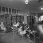 Black and white photograph of women reading in library, Rochester State Hospital, c.1930.