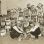 Black and white photograph of a police raid on slot machines, St. Paul, 1935. Photograph from the St. Paul Daily News. 