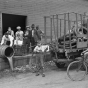 Black and white photograph of a group of people dismantling a still at Pillsbury and Charles Streets in St. Paul, c.1925.