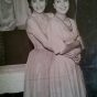 Black and white photograph of Hilda Simms (right) posed with one of her younger sisters, Laura, c.1955. 