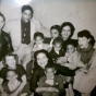 Black and white photograph of Hilda Simms surrounded by her mother, several of her siblings, and nephews, c.1955.