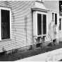 Black and white photograph of Frederick A. Scherf's home splattered with paint. 