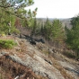 Color image of a hiker on rocky hill in Lake Vermilion–Soudan Underground Mine State Park. Photograph by Minnesota Department of Natural Resources Staff, October 30, 2007.