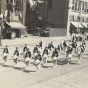 Black and white photograph of the American Legion drum and bugle corps on parade at state competition in Albert Lea, Minnesota, August, 1935.