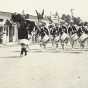 Black and white photograph of the American Legion Auxiliary drum and bugle corps on parade in Bagley, Minnesota, 1935.