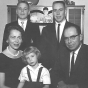 Black and white photograph of Ernotte and Ardis Hiller (seated), holding Mary Hiller; in the back are Chuck Hiller (right) and Jeff Hiller (left), 1961.