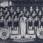 Black and white photograph of the drum and bugle corps in pajama uniforms, 1930s.