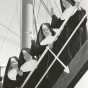 Black and white photograph of Sister Irmina Kelehan (bottom left) and other Sisters of St. Joseph setting sail for Japan, 1956.