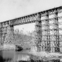 High bridge over the Kettle River near Sandstone, before September 1, 1894, and after the trees in the area were cut down by a logging company, which left highly flammable debris (slash) to serve as fire fuel. Photograph Collection, Sandstone History and Art Center, Sandstone.