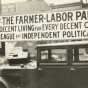Black and white photograph of a Farmer-Labor political poster atop an automobile, c.1925.