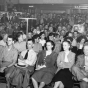 Black and white photograph of a Socialist Workers Party meeting, ca. 1940. Vincent R. Dunne and Grace Carlson in center.