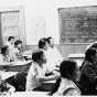 Black and white photograph of Hmong students in a class at the Lao Family Community Center inside a branch of the St. Paul YMCA, c.1980. 