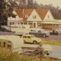 Color image of Lamb’s Resort, ca. 1968, after Skip and Linda Lamb purchased it; a new laundry and grocery addition is at the right of the inn.