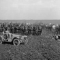 Black and white photograph of men, horses, farm implements in field, Northcote farm, Northcote, Minnesota, 1914. Photograph by William Hartvig.