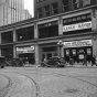 Black and white photograph of a Minneapolis street corner showing the Farmer-Labor Party headquarters, 1937.