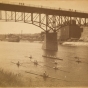 The Minnesota Boat Club racing on the Mississippi River, St. Paul, ca. 1890.