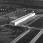 Black and white photograph of Northwest Orient Airlines hangar and offices at the Minneapolis-St. Paul International Airport, c.1960. Photographed by Marty Nordstrom Photography.