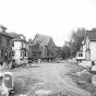 Black and white photograph of Houses being moved, undated.