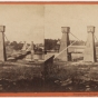 Black and white photograph of the Hennepin Avenue Bridge looking toward Nicollet Island, c.1865.