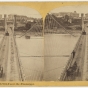 Black and white photo negative of the Hennepin Avenue Bridge, c.1868.