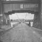 Black and white photograph of the ground level view of the Hennepin Bridge, c.1868.
