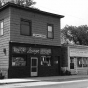 Black and white photograph of U-Meet-Us, Black Senior Citizens Lounge, and Minneapolis Urban League, East 38th St and 4th Ave, Minneapolis, 1975.