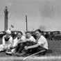 Group next to memorial tree planted on Victory Memorial Drive 