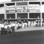 Photograph of Municipal Stadium, the home of the St. Cloud Rox from 1948-1970, showing the exterior of the stadium and a line of people waiting to get into the game, c.1950. From the Myron Hall Collection, Stearns History Museum and Research Center, St. Cloud.