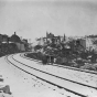 Black and white photograph of the Swede Hollow neighborhood taken from the St. Paul and Duluth Railroad tracks, c.1910.